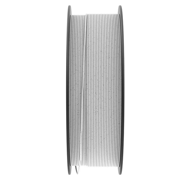 Numakers PLA Marble filament spool on a grey reel, white with black speckled pattern.