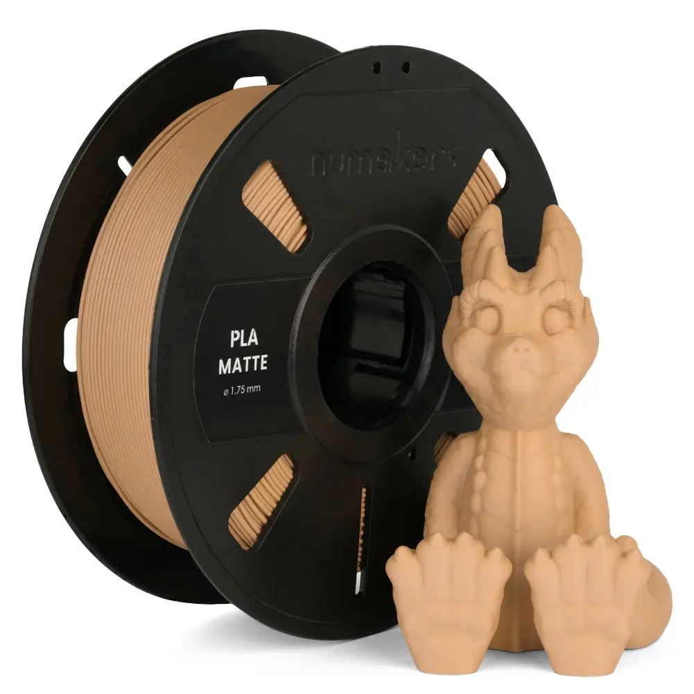 Numakers PLA Matte filament spool in beige (1.75 mm) beside a small dragon figurine