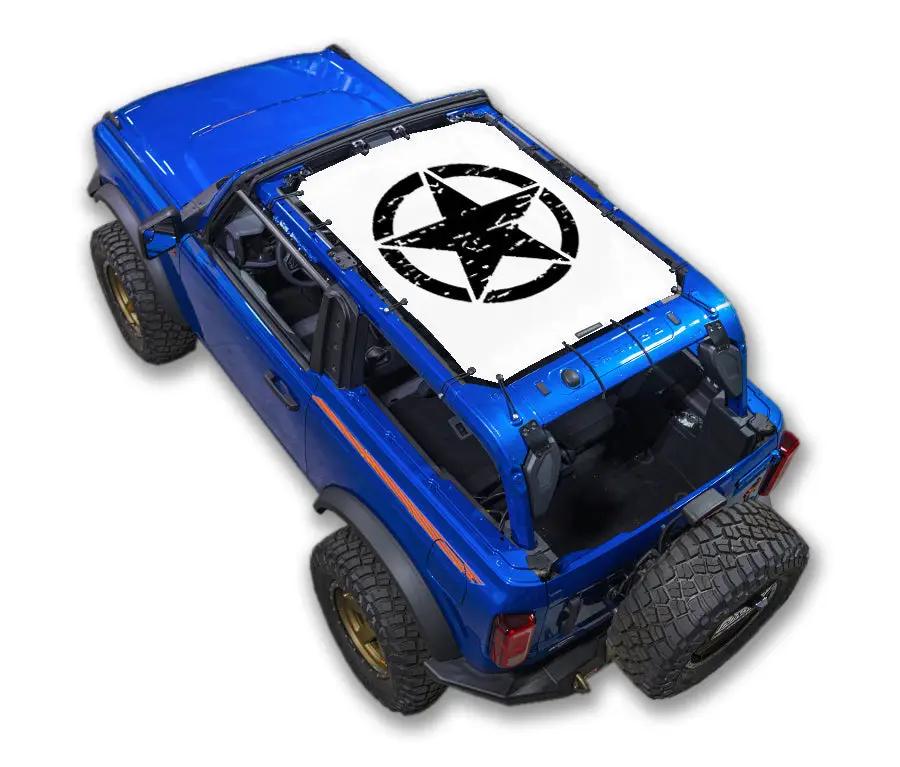 Ford Bronco Sun Shade by SpiderWebShade; white printed top with black star logo on a blue Bronco SUV