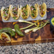 Artec Industries ARTACO Cinco five-taco holder on metal board with five tacos