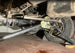 4Link4WD Master Gear Setup Tool Kit undercarriage view on 4WD, steel rod across yellow mounting plate near differential