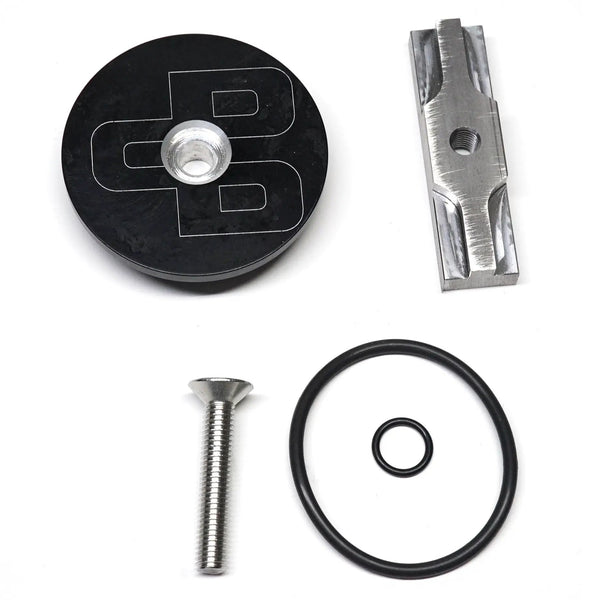 Power Driven Diesel Billet Side Freeze Plug kit: black plug with silver insert, metal mounting block, O-rings, screw
