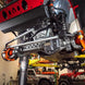 Superduty Swap Aluminum Steering Kit Artec Industries view on a lifted off-road vehicle, orange suspension arms