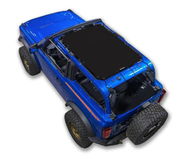 SpiderWebShade sun shade for Ford Bronco 2021–2026; solid black shade top on blue SUV