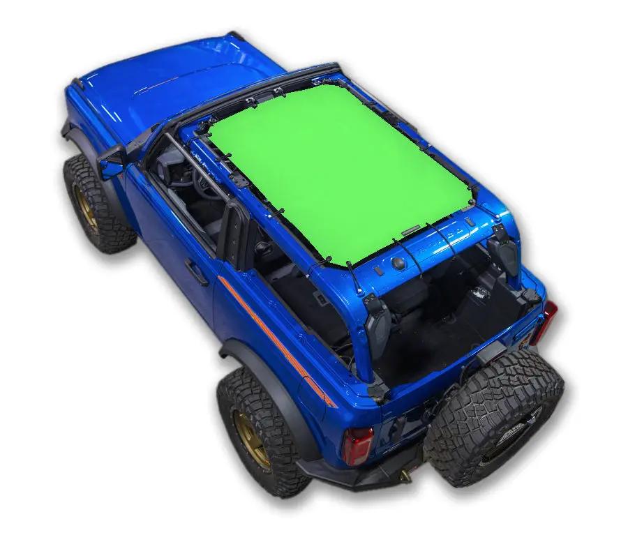 Sun shade top for Ford Bronco (2021–2026) by SPIDERWEBSHADE; green panel on blue Bronco.
