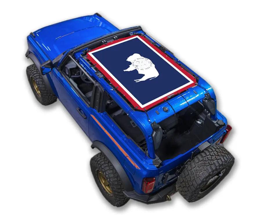 Sun shade top for Ford Bronco (2021–2026) by SpiderWebShade; navy panel with white bear silhouette and red border