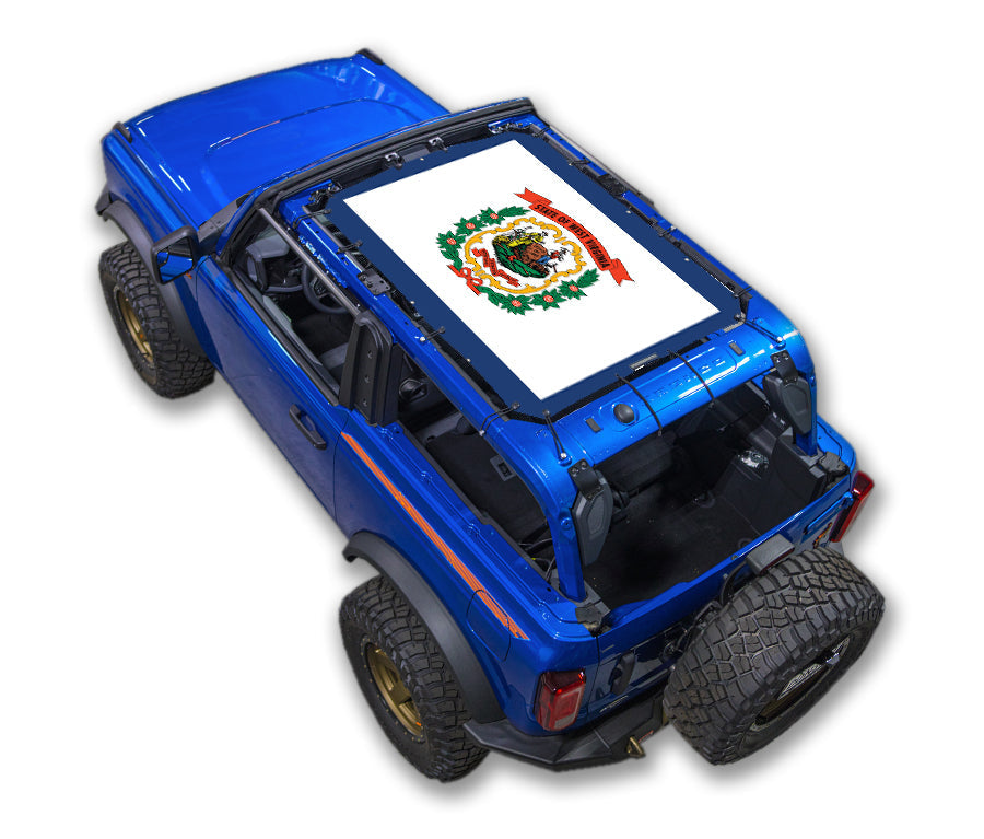 SPIDERWEBSHADE sun shade for Ford Bronco (2021–2026) on blue SUV with stock printed top design