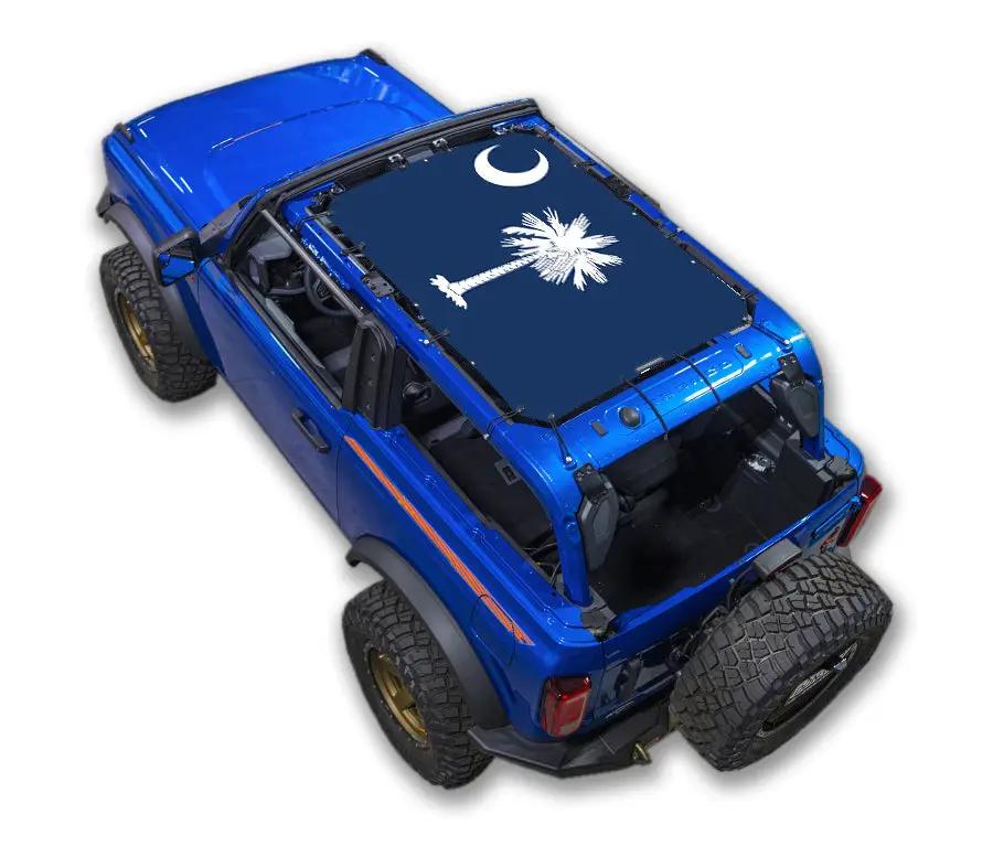 Ford Bronco sun shade top by SpiderWebShade in navy blue with white palm tree and crescent moon design