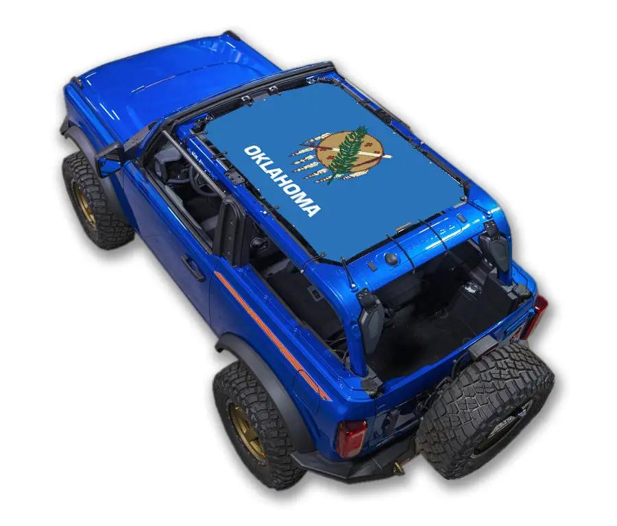Ford Bronco sun shade by SpiderWebShade; blue stock printed shade top with Oklahoma flag design