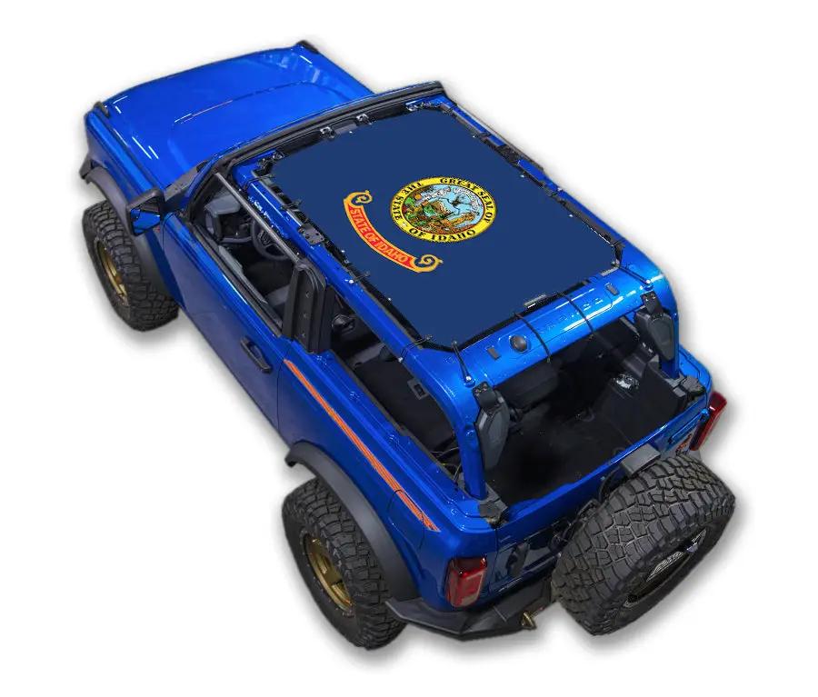 Ford Bronco sun shade top by SpiderWebShade; blue stock printed roof shade (2021–2026).