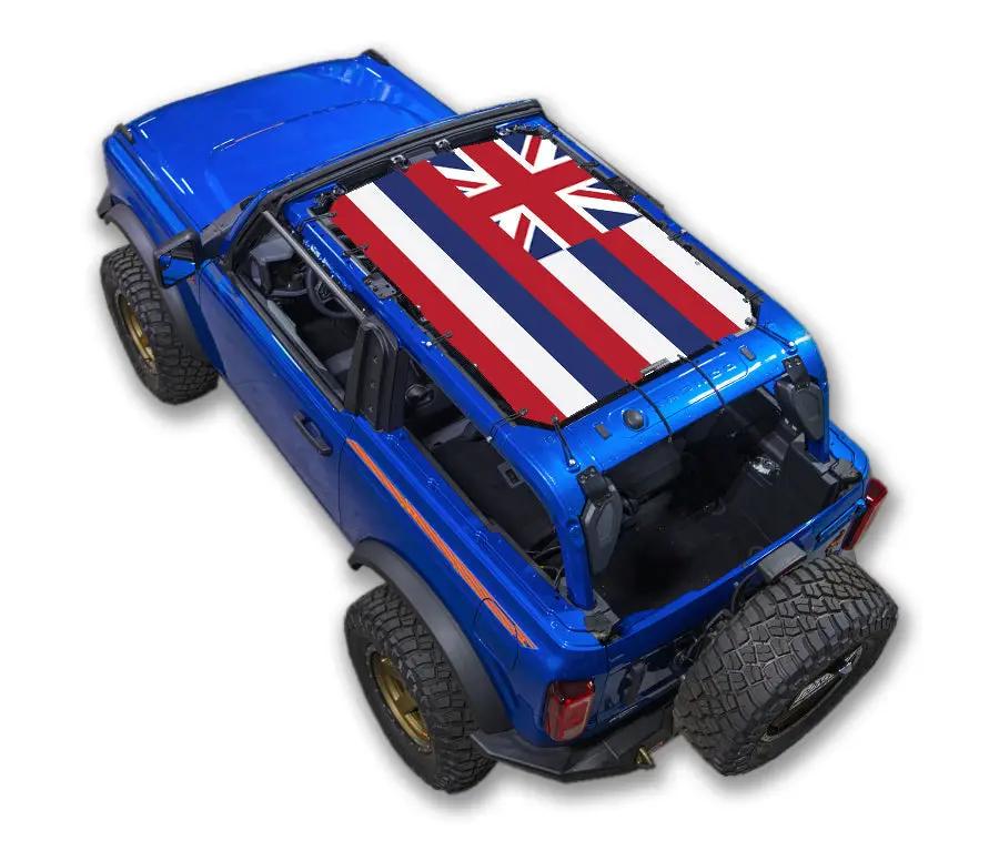 Sun shade top for Ford Bronco by SPIDERWEBSHADE, blue Bronco with Hawaii flag printed roof.