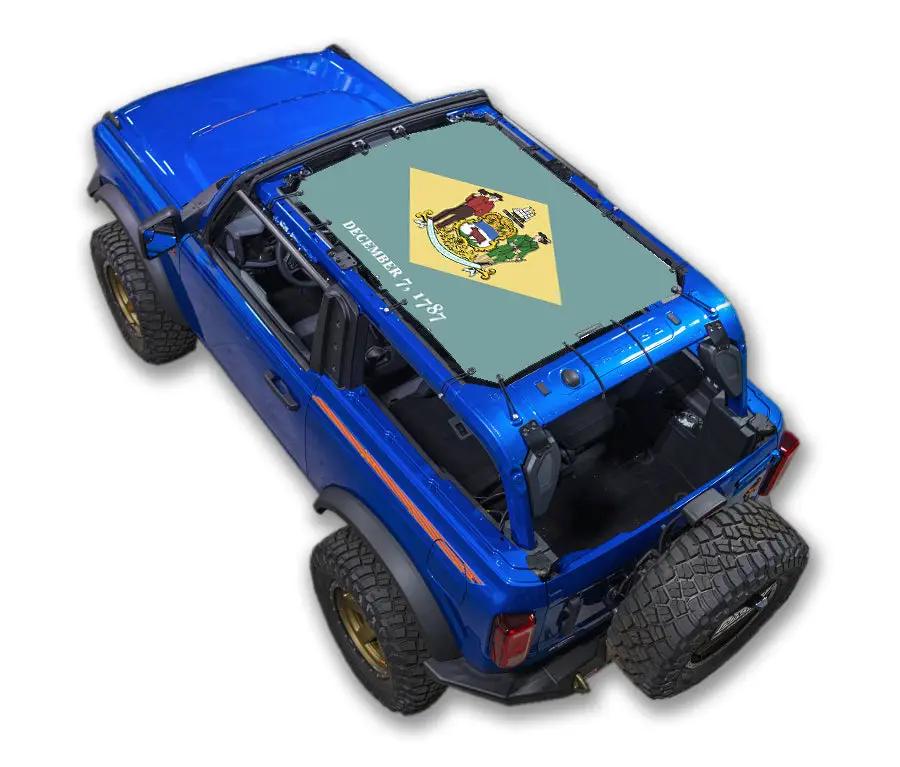 Ford Bronco Sun Shade Stock Printed Shade Top (2021–2026) by SpiderWebShade, blue SUV with green-printed shade top