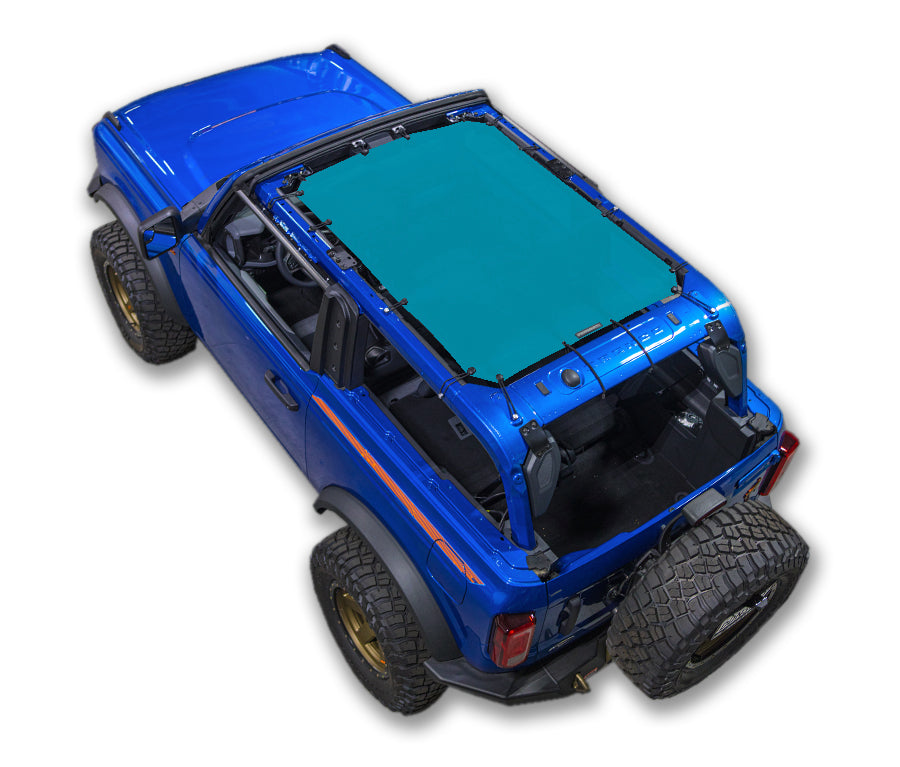 SPIDERWEBSHADE Sun Shade for Ford Bronco; green stock-printed shade top on blue SUV.