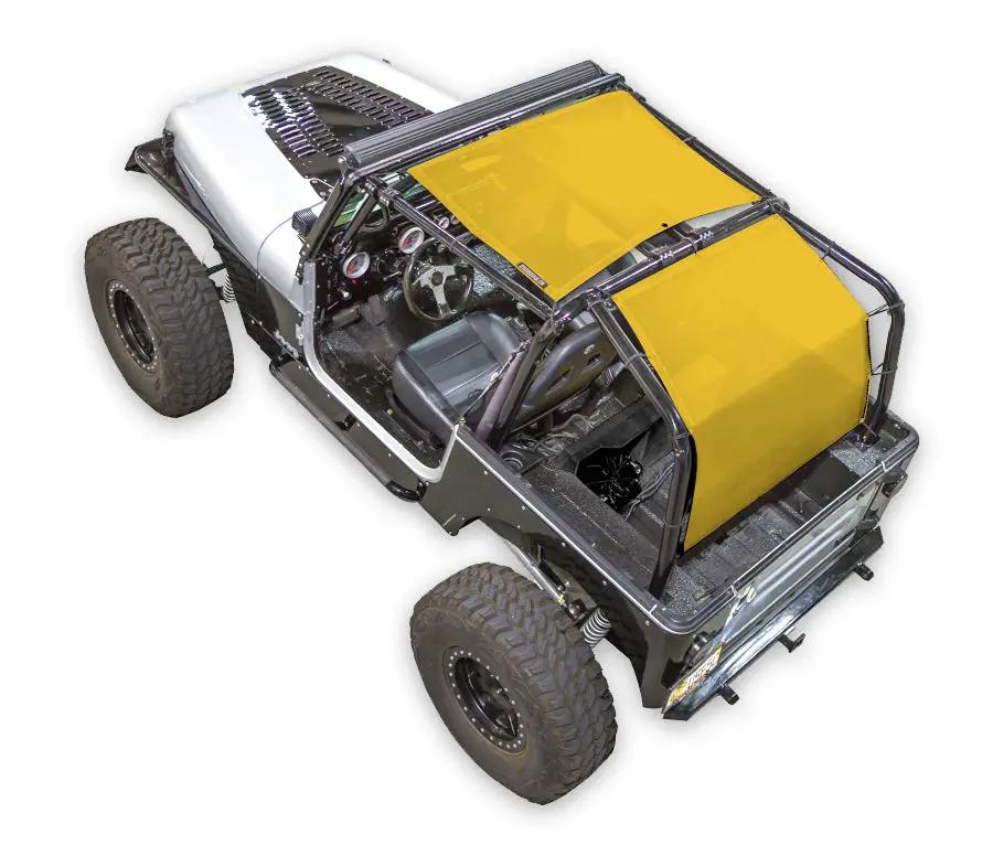 Sun shade top by SpiderWebShade for Jeep Wrangler YJ (1987–1996), solid yellow color on off-road vehicle