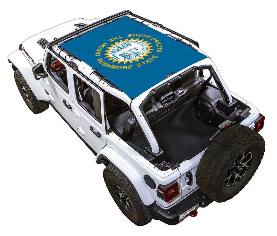 SpiderWebShade sun shade for Jeep Wrangler JLU 4-Door, blue stock-printed roof shade with Rushmore state seal.