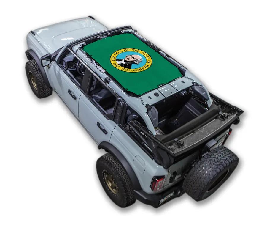 Sun shade SpiderWebShade for Ford Bronco (2021–2026), green printed top with emblem on blue Bronco SUV