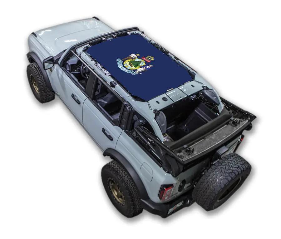 Ford Bronco sun shade by SPIDERWEBSHADE; navy stock printed top with crest emblem