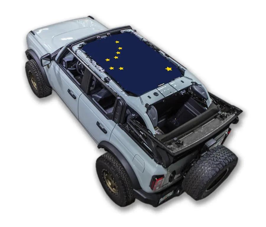 Sun shade for Ford Bronco (2021–2026); navy blue printed top with yellow star pattern.