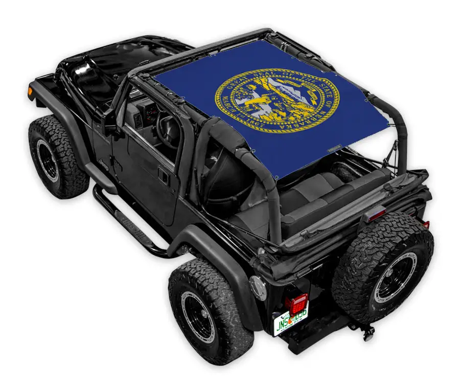SpiderWebShade sun shade on Jeep Wrangler TJ (1997–2006); blue printed shade top with yellow seal logo