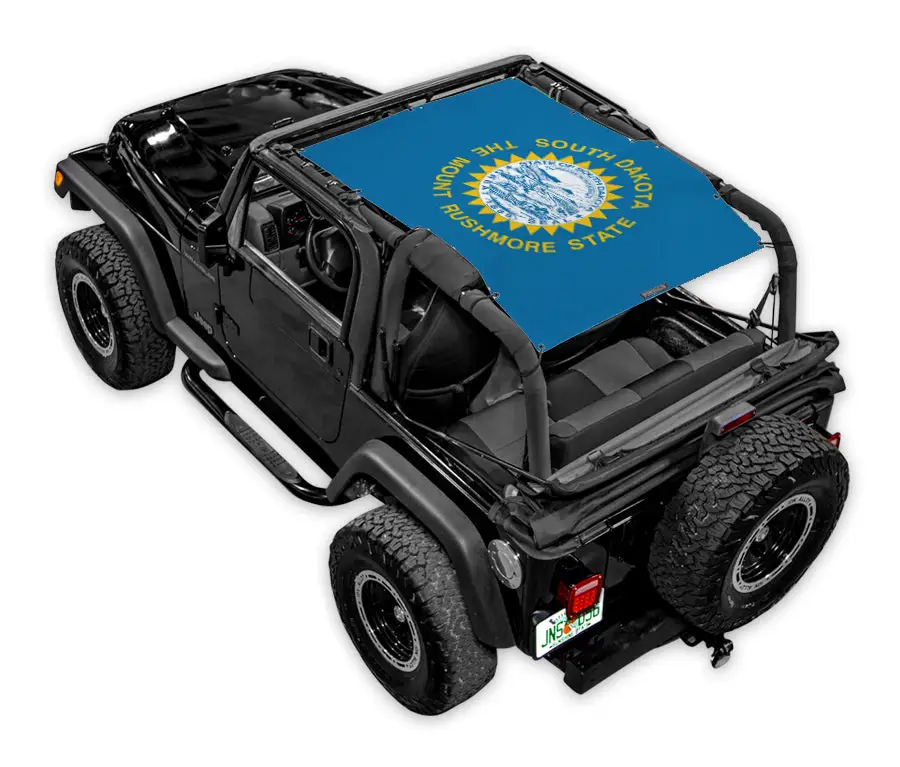 SpiderWebShade sun shade top on a black Jeep Wrangler TJ; blue printed shade with a yellow sunburst emblem