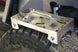 Artec Tire Tool Tray metal tray mounted above off-road tire; holds wrenches; Artec Industries logo visible