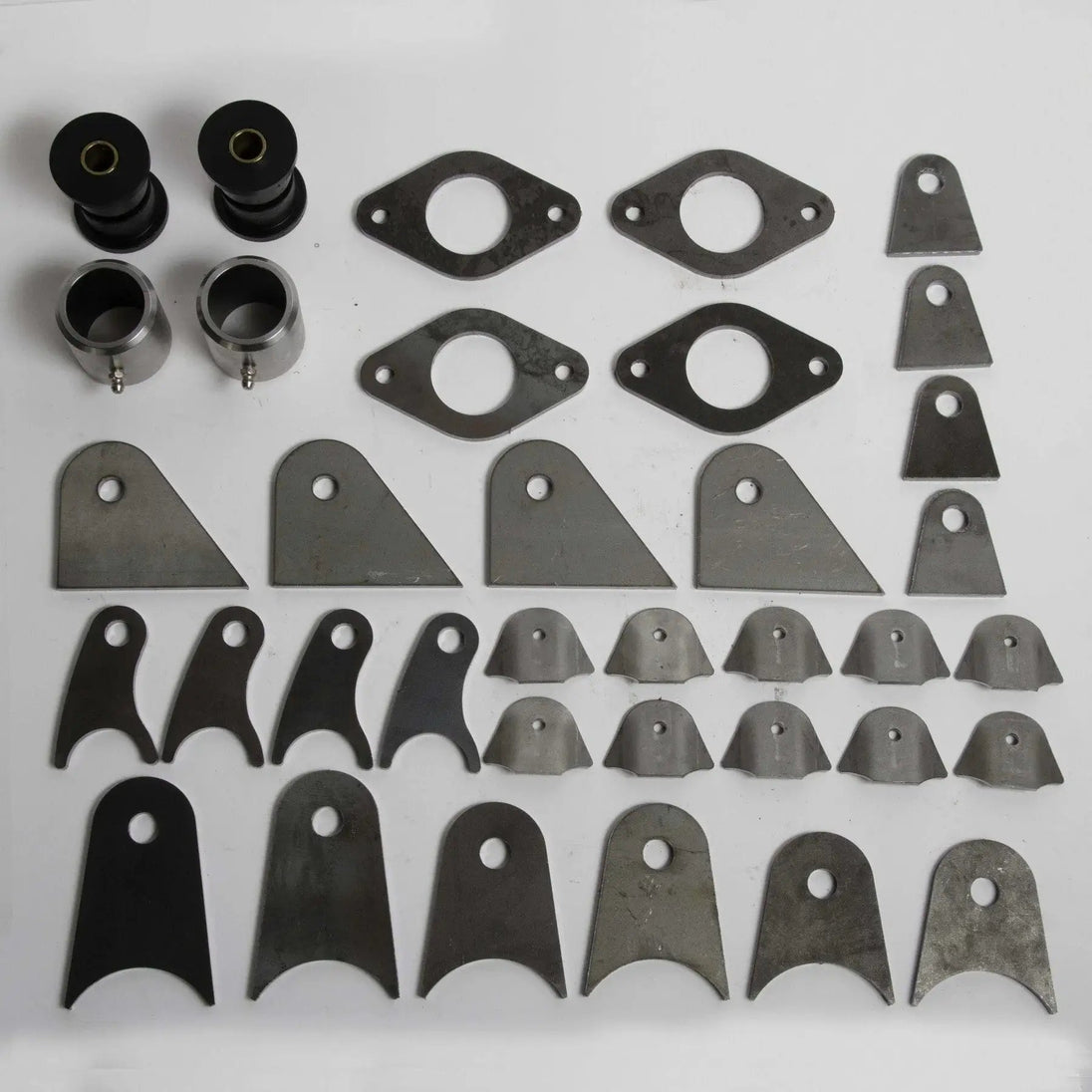 Skinny Pedal Racing TMR Smith Pack – DIY Starter Kit with 2 poly bushings & assorted mounting tabs, spacers, plates