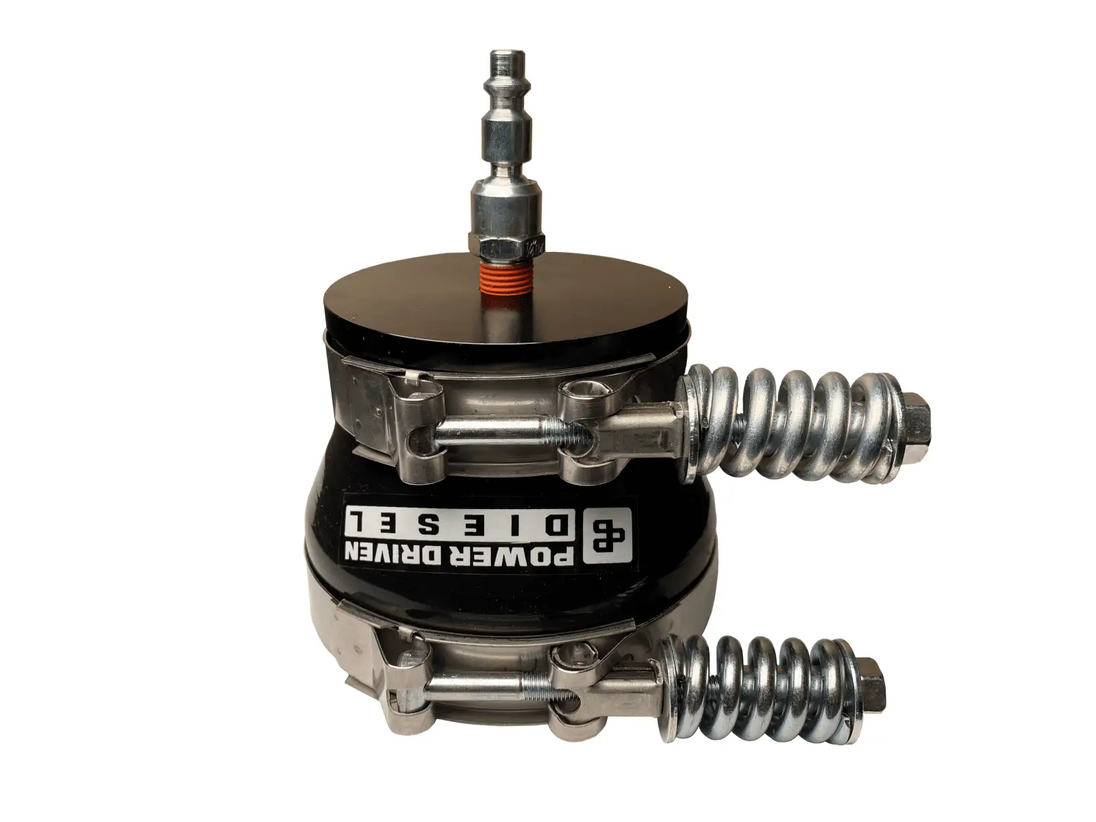 Power Driven 4-inch Boost Leak Tester, black base, orange-threaded top fitting, coiled metallic hose, Power Driven Diesel