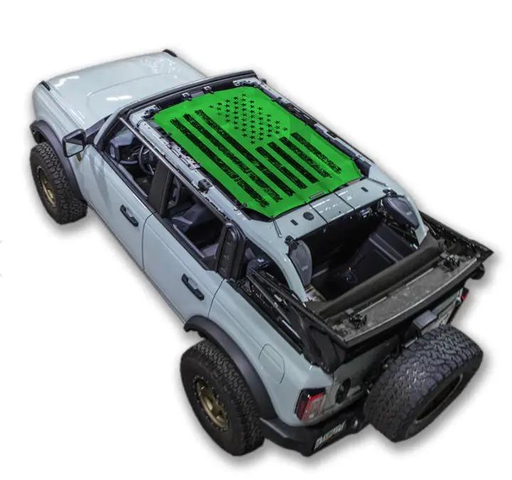 Sun shade SPIDERWEBSHADE for Ford Bronco (2021–2026); bright green stock printed top with black US flag design.