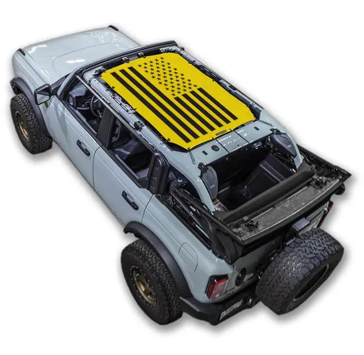 SpiderWebShade sun shade for Ford Bronco (2021–2026); stock printed top with yellow US flag design.