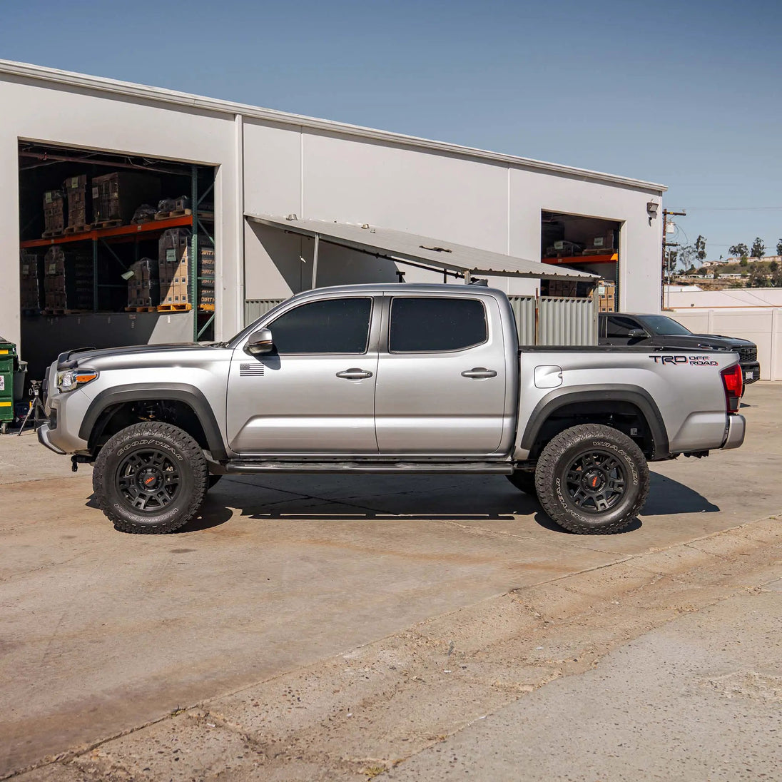 2.0 IFP Coilovers Toyota Tacoma TRD Off Road pickup, silver, near warehouse