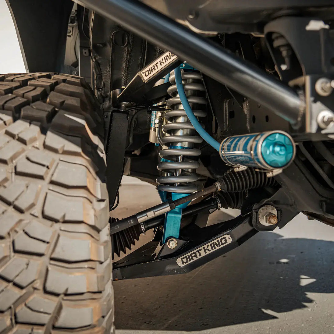 Dirt King Long Travel Kit Toyota off-road suspension with blue coilover shock and coil spring