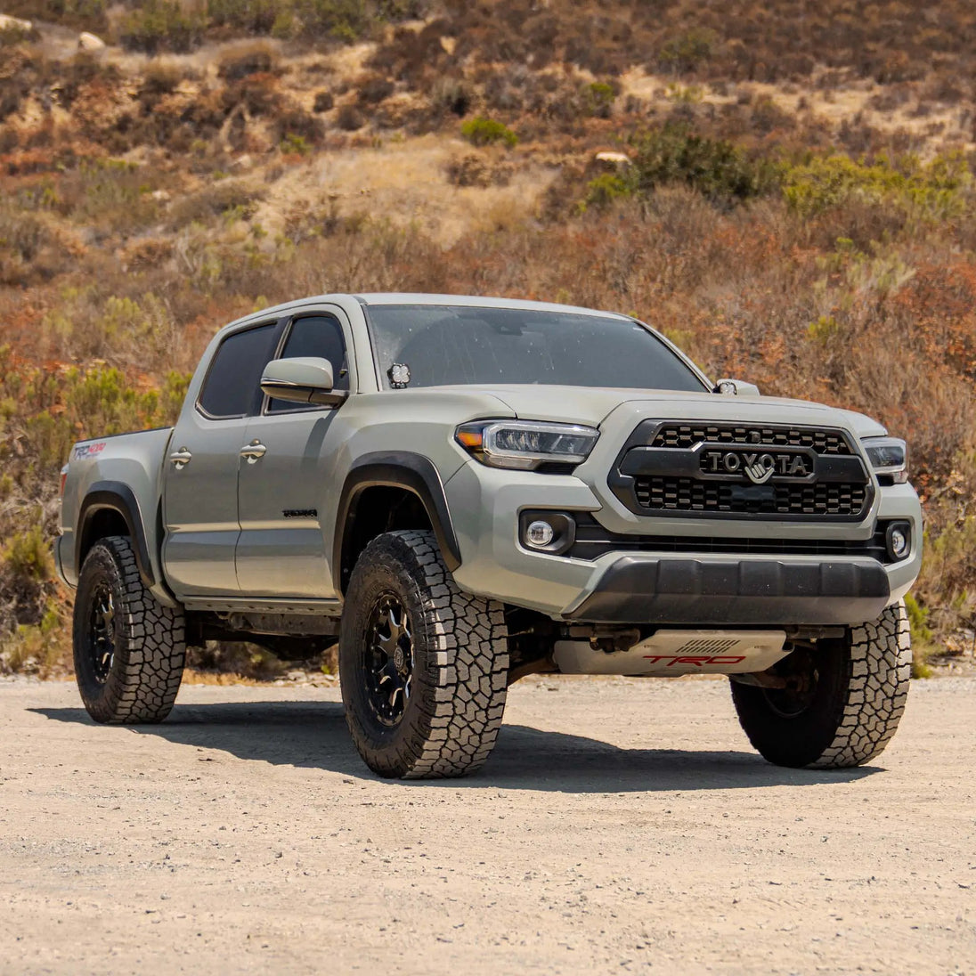 Dirt King 2.5 Coilovers DCA Remote Reservoir for Toyota pickup, front view with TRD Pro badge