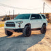 Long Travel Kit Toyota Dirt King installed on white Toyota SUV with lifted suspension