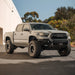 Long Travel Kit Dirt King Toyota pickup front view with lifted suspension and oversized tires