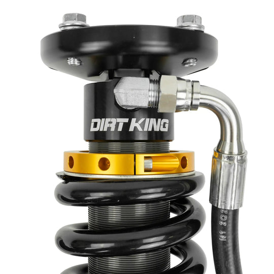 Dirt King 2.5 Coilovers DCA Remote Reservoir Toyota shock assembly, black body with gold lower mount and braided hose