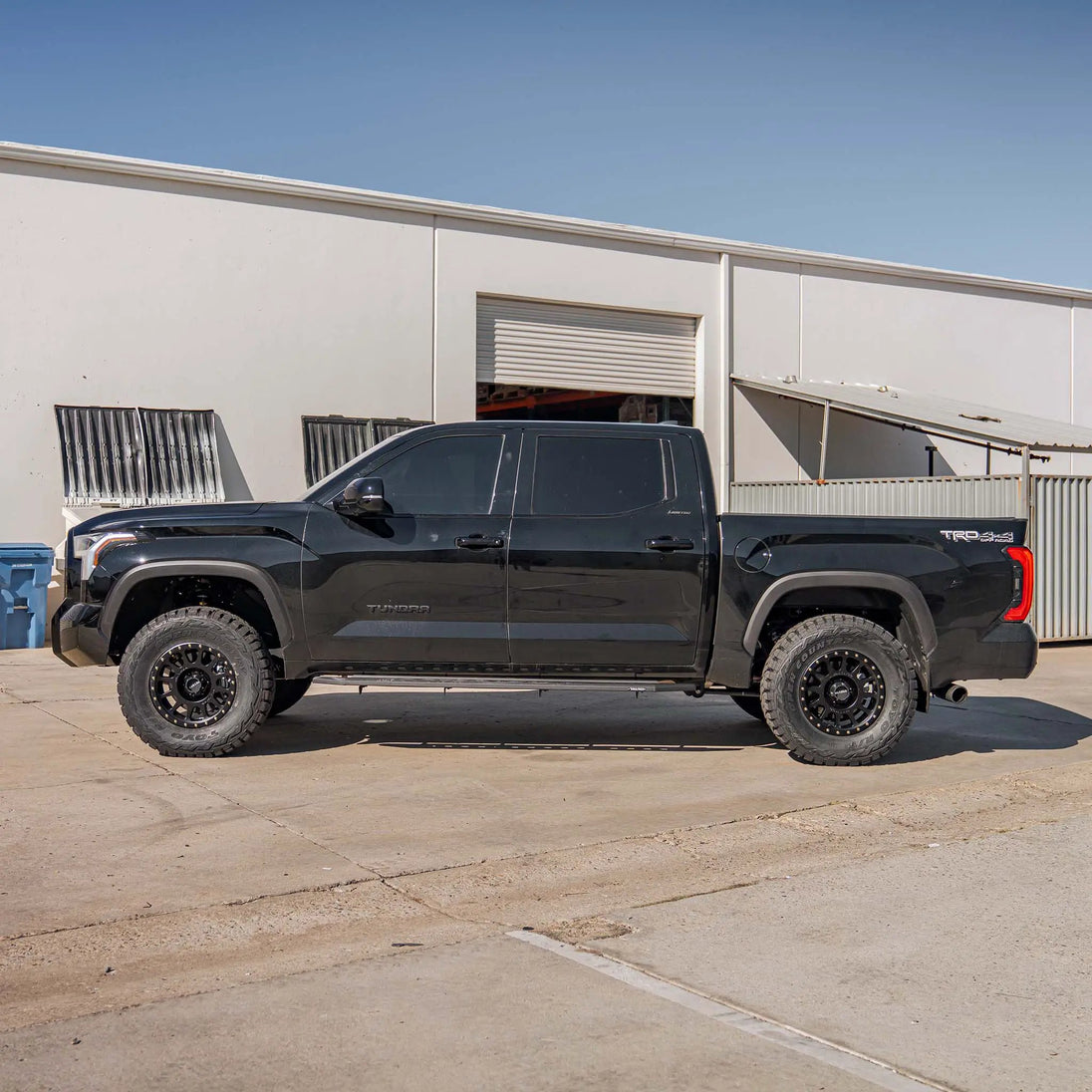 2.0 IFP Coilovers Dirt King Toyota Tundra black pickup with aftermarket wheels