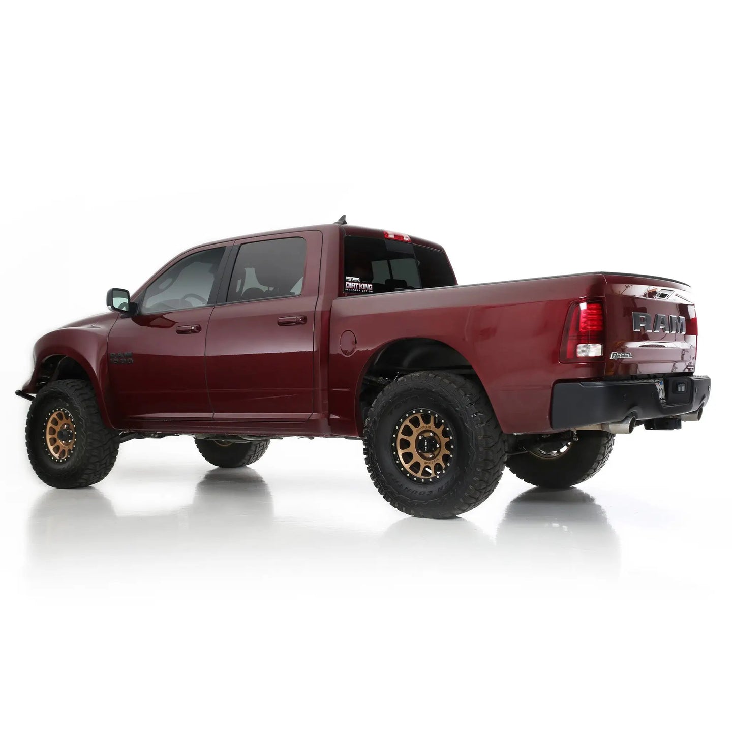 Long Travel Kit Dirt King for Ram 1500 Rebel red pickup with Dirt King logo on rear window