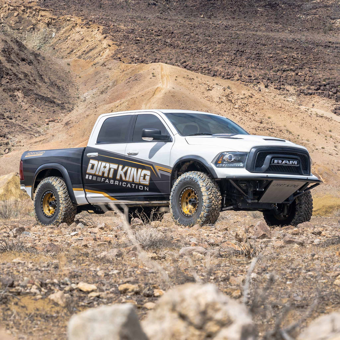 Dirt King Long Travel Kit Ram pickup truck with Dirt King Fabrication graphics