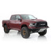 Dirt King Long Travel Kit for Ram 1500 - red pickup with bronze wheels and lifted suspension