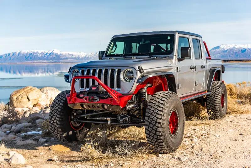 Artec Nighthawk Front Bumper with Aluminum Skid for JK/JL/JT - red bumper on gray off-road SUV